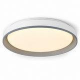 A modern flush-mount circular ceiling light with a white outer frame and a warm yellow illuminated diffuser, shown against a plain white background.