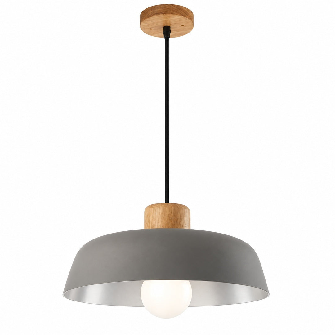 A modern pendant light with a matte gray dome shade, a silver interior, a black cord, and natural wood accents on the canopy and neck, with a glowing light bulb visible inside.