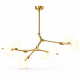 Gold-tone chandelier with angular branching arms and clusters of glowing white globe shades, shown at an angle against a white background.