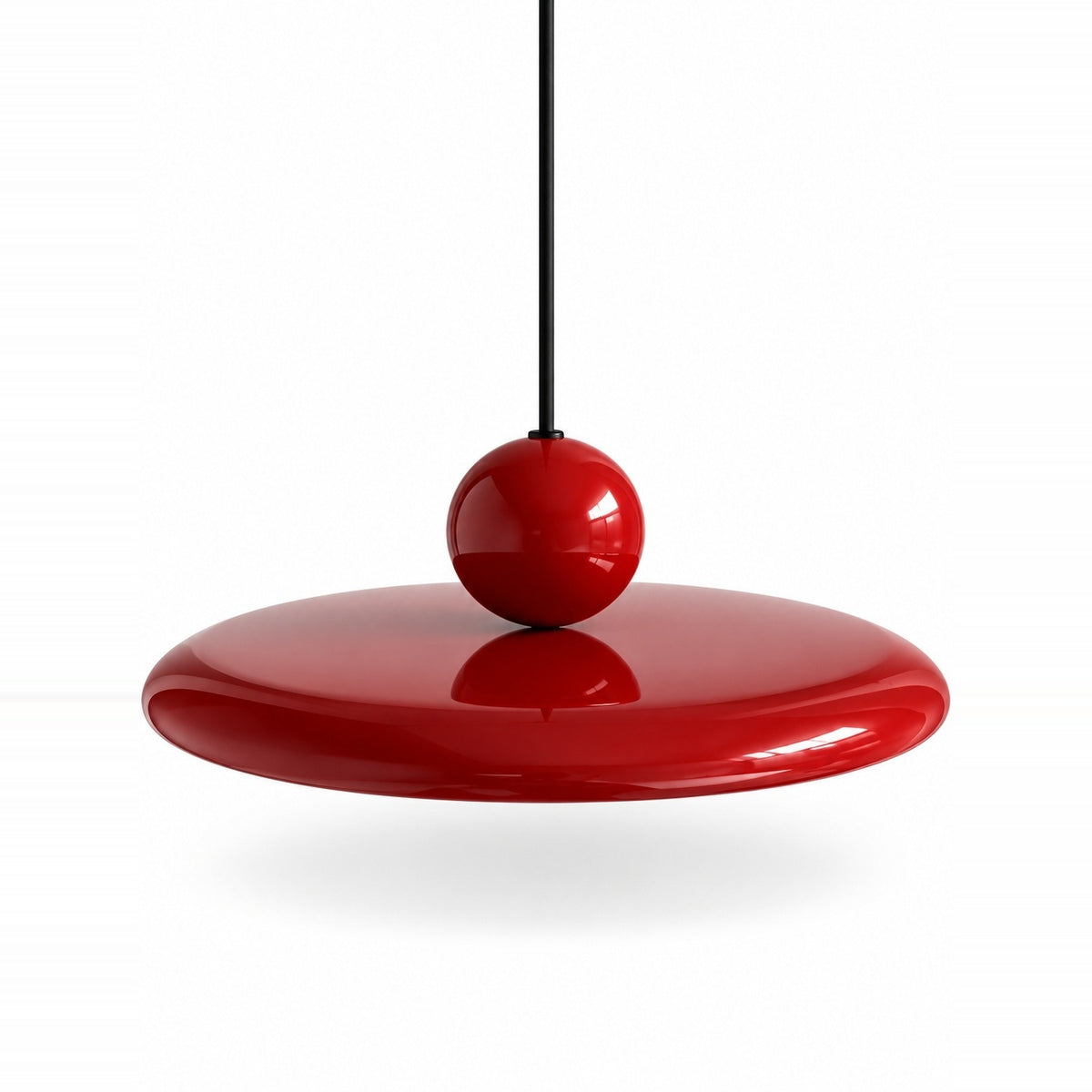 Pendant light with a glossy red disc shade, matching red sphere, and black suspension cord against a white background.