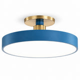 A modern semi-flush mount ceiling light featuring a matte blue cylindrical shade and brushed gold metal mounting hardware, shown against a solid white background.