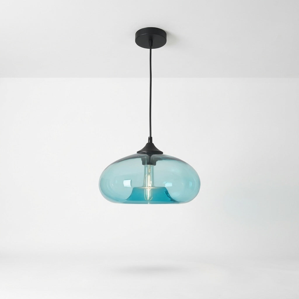 A modern pendant light with a translucent light blue glass shade and a matte black ceiling canopy and cord, shown against a clean white wall and ceiling.