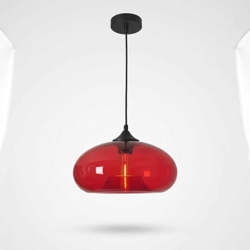 A modern pendant light with a glossy, rounded red glass shade and a matte black ceiling canopy and cord, shown against a light gray background.