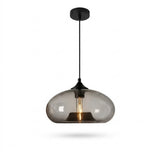 A modern pendant light with a rounded, dome-shaped smoked glass shade and a matte black metal canopy, rod, and cap, shown against a plain white background.