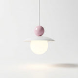 A modern pendant light with a white disc-shaped shade, a pale pink spherical accent, and a glowing frosted globe bulb, suspended against a clean white background.