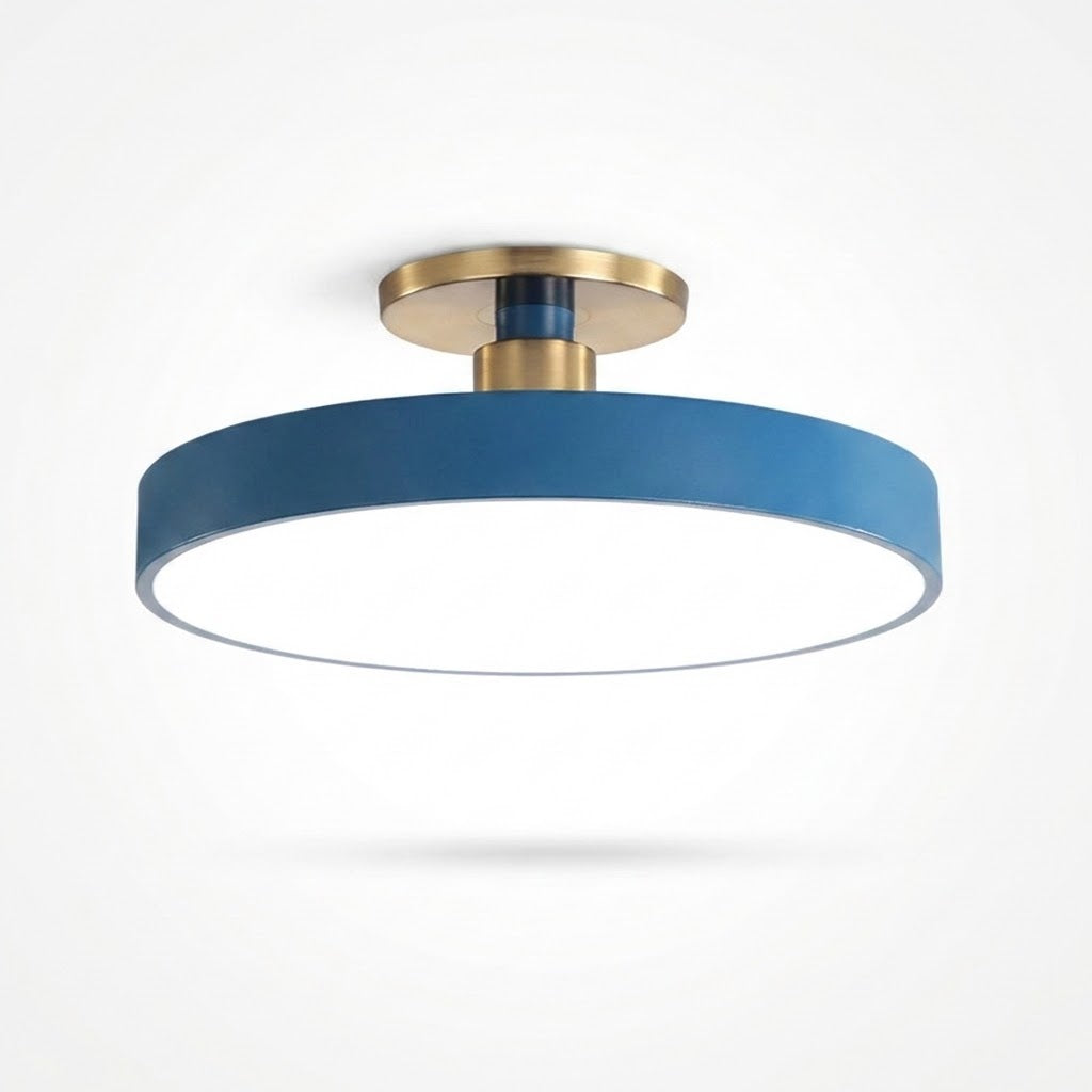 A modern semi-flush mount ceiling light with a matte blue cylindrical shade, a white diffuser, and brushed brass metal hardware, shown against a plain white background.