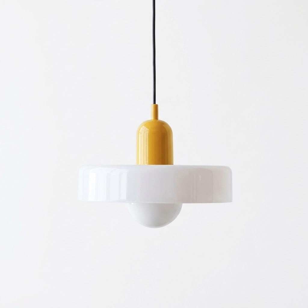 A modern pendant light with a wide white flared shade, a yellow cylindrical socket, and a black hanging cord, shown against a plain white background.