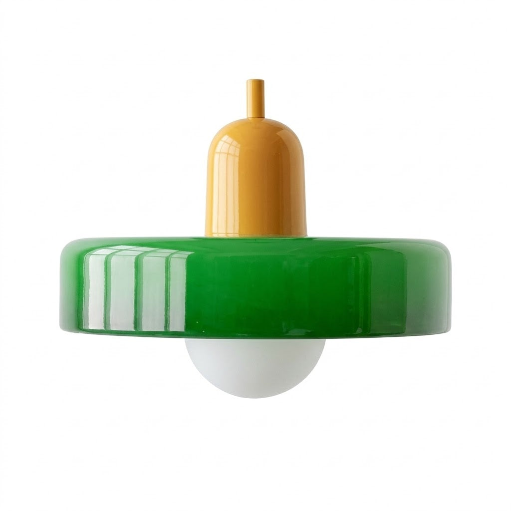 A retro-style pendant light fixture with a glossy green circular shade, a mustard yellow central stem, and a white glass globe bulb, shown against a plain white background.
