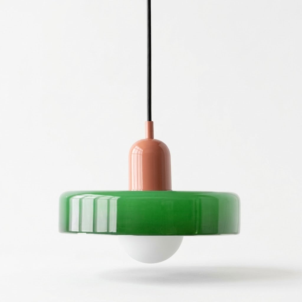 A modern pendant light with a glossy green circular shade, a terracotta-colored central stem, a black suspension cord, and a white glass globe bulb, shown against a plain white background.