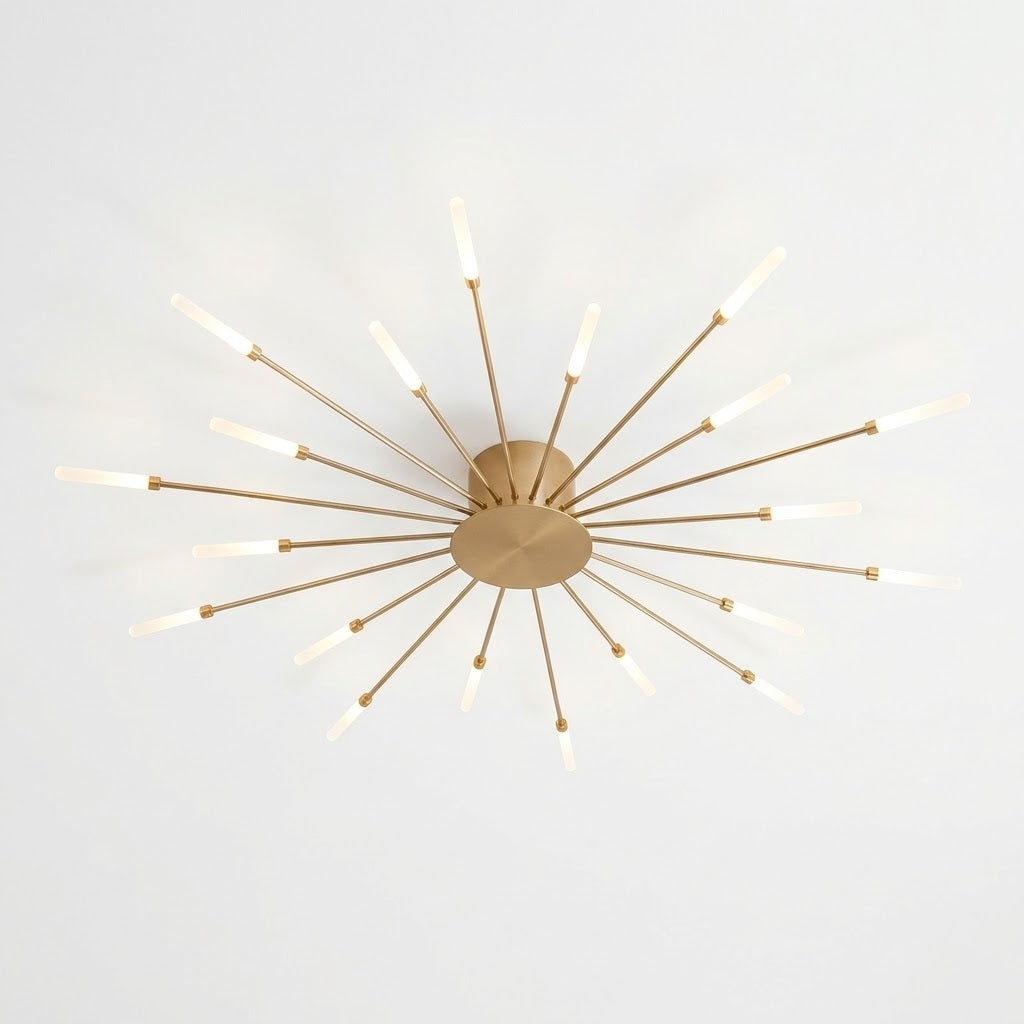 A modern starburst ceiling light fixture with a brushed gold finish and multiple illuminated frosted glass bulbs on radiating arms, shown against a plain white ceiling.