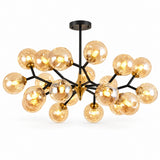 A modern chandelier with a black metal frame and multiple warm amber-tinted glass globes, shown against a plain white background.
