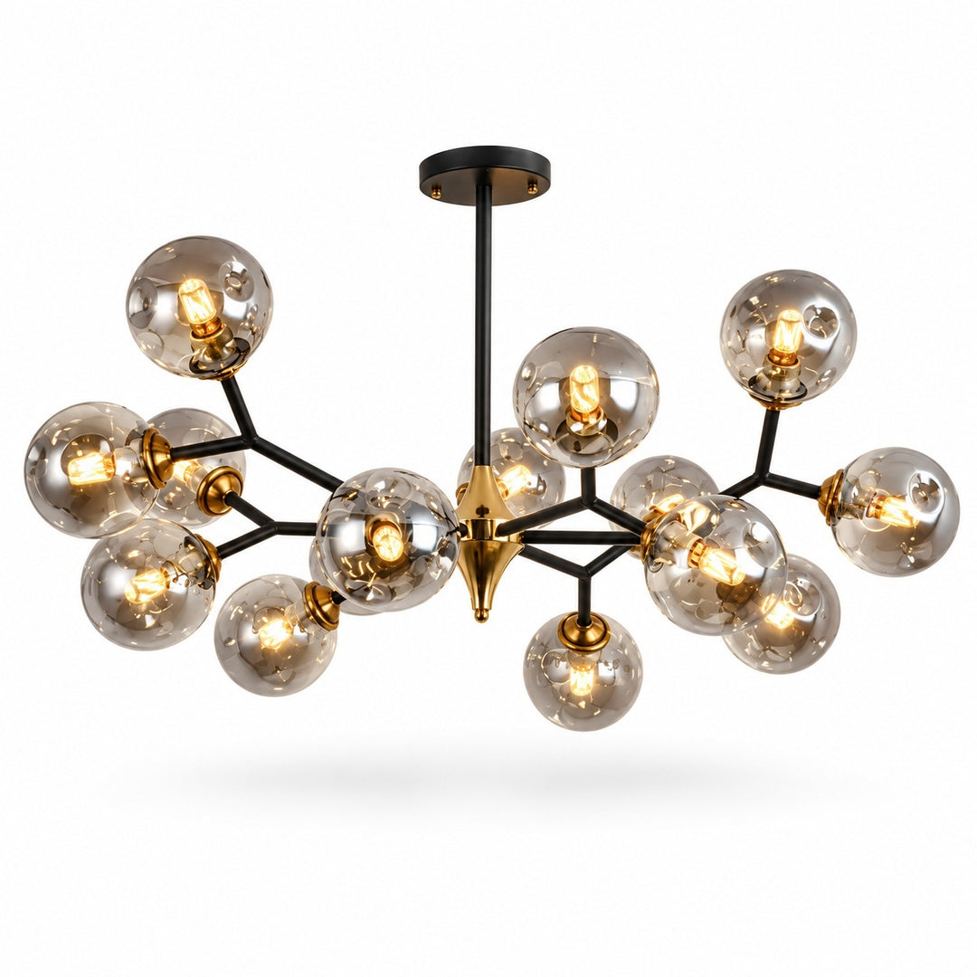 Modern chandelier with a black metal frame and multiple clear glass globes, each containing a glowing warm bulb, with a gold central finial, shown on a white background.