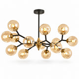 A modern multi-arm chandelier with a black metal frame and multiple clear glass globes, shown illuminated against a plain white background.