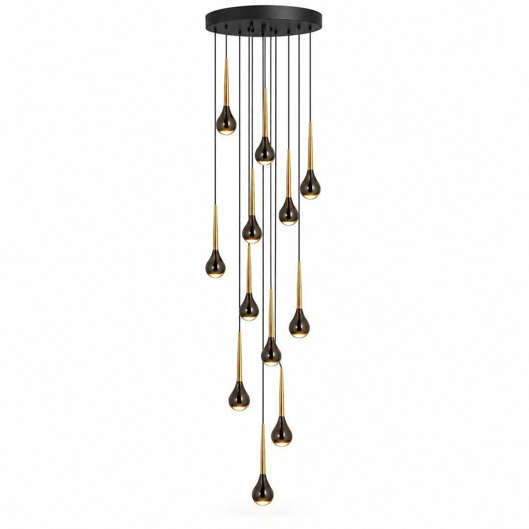 A modern multi-light chandelier with a circular black ceiling canopy, featuring multiple slender black cords suspending teardrop-shaped bulbs with a brushed gold finish, set against a plain white background.