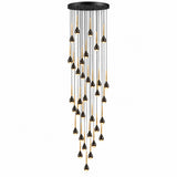 A modern multi-light linear chandelier with a black circular ceiling canopy, black metal rods, and numerous teardrop-shaped bulbs with black tops and gold lower rims, shown against a plain white background.