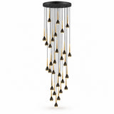 A modern multi-light linear chandelier with a matte black canopy and multiple hanging teardrop-shaped bulbs that have black tops and brushed gold middle sections, shown against a plain white background.