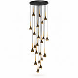 A modern multi-light chandelier with a circular black ceiling mount from which multiple black cords hang teardrop-shaped bulbs with gold-toned inner shades, shown against a plain white background.