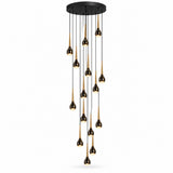 A modern multi-light chandelier with a circular black ceiling canopy and twelve hanging teardrop-shaped bulbs in a glossy black and brushed gold finish, shown against a plain white background.