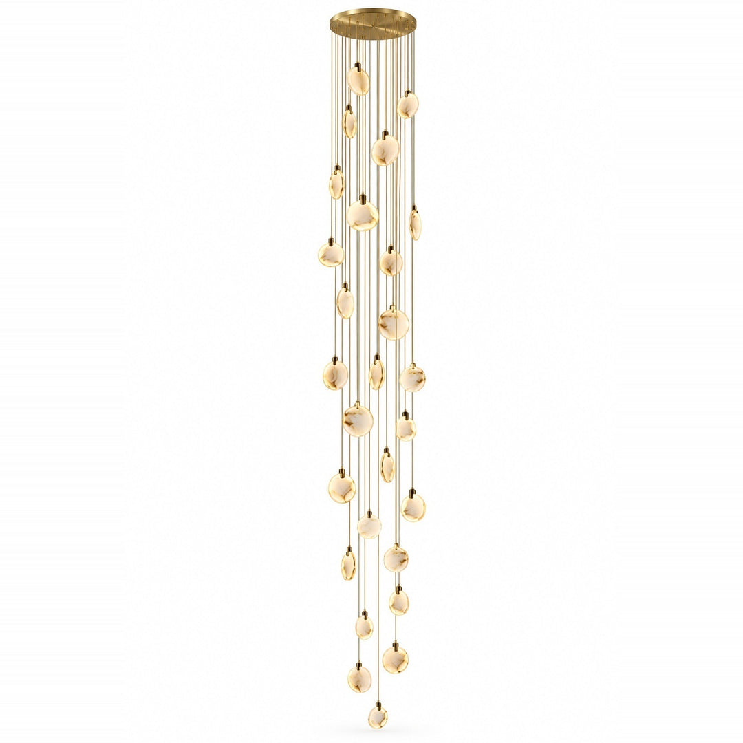 A modern multi-light linear chandelier with a brushed gold finish, featuring multiple clear glass disc shades that hang in a cascading, wind-like motion from thin gold wires, set against a plain white background.
