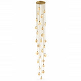 A modern multi-light linear chandelier with a brushed gold finish, featuring multiple clear glass disc shades that hang in a cascading, wind-like motion from thin gold wires, set against a plain white background.