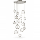 A modern multi-light linear chandelier with clear glass spherical pendant globes suspended from a brushed silver metal canopy and rods, shown against a plain white background.