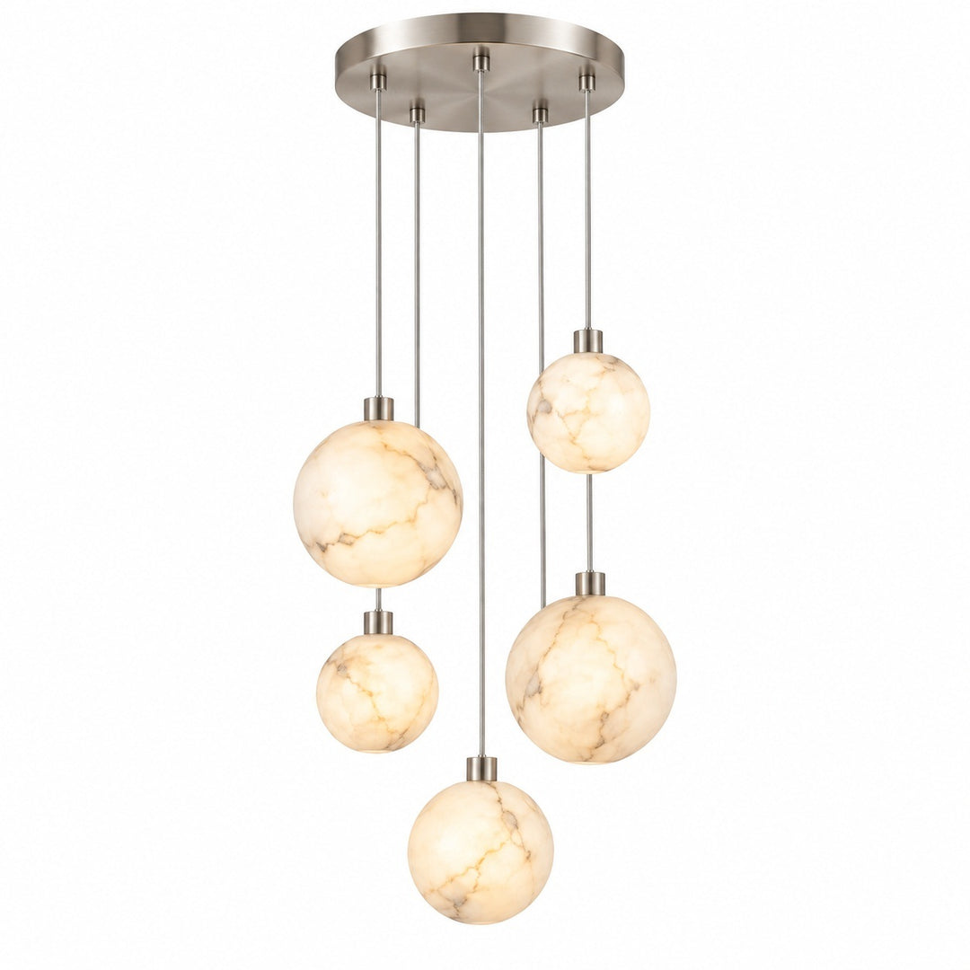 A modern multi-light pendant chandelier with five spherical marble glass shades of varying sizes hanging from a circular brushed nickel canopy.