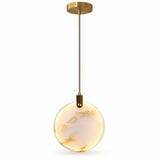 A chandelier features a warm cream marble disc with sparse gold veining, a gold stem, and a round canopy against white.