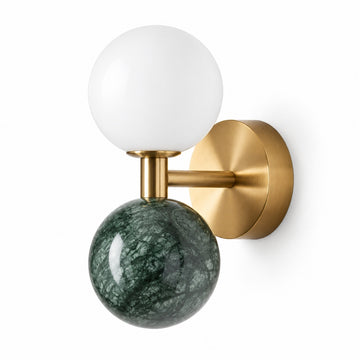 Modern wall sconce with a matte white spherical glass shade, a polished dark green marble orb, and a brushed brass wall mount.
