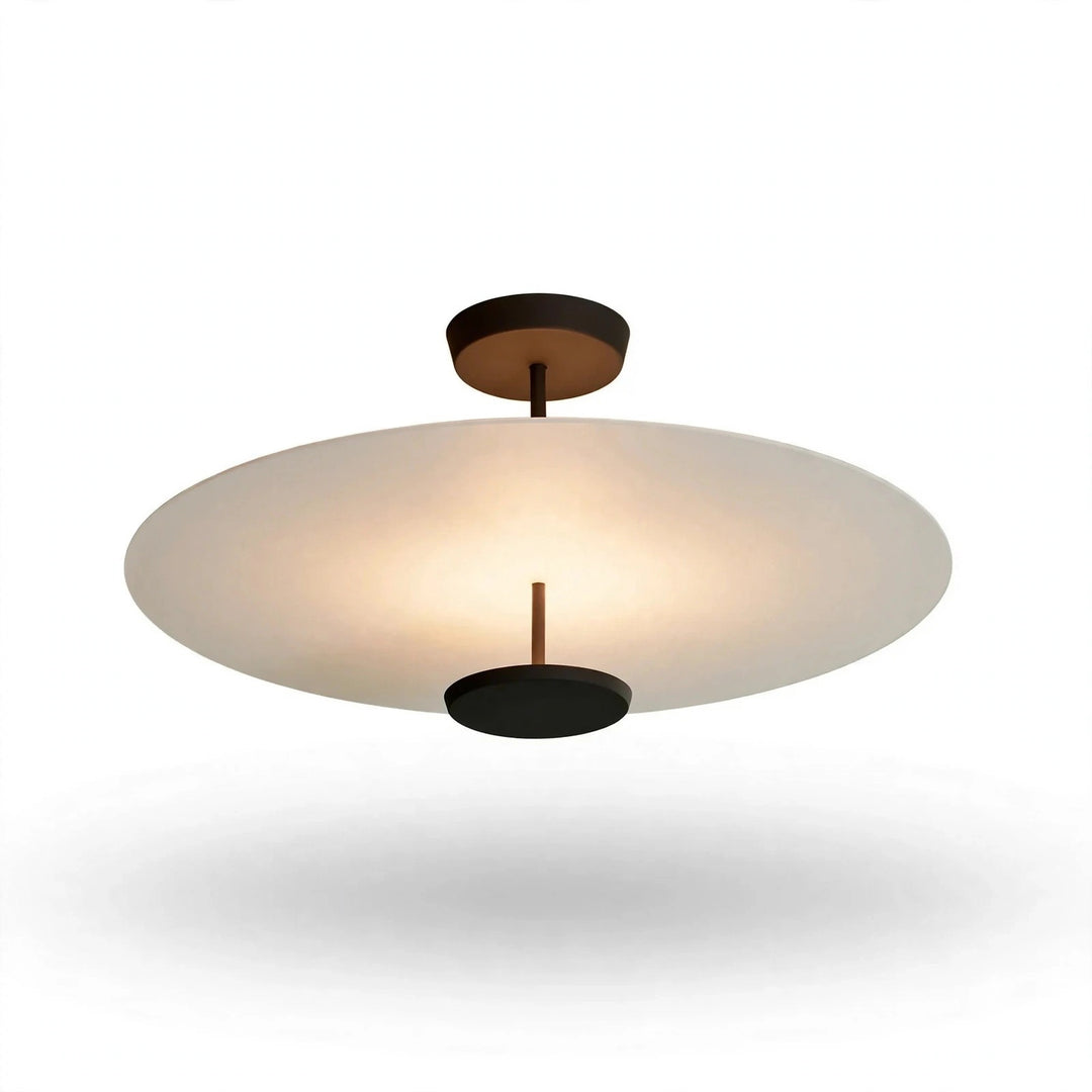 A modern semi-flush mount ceiling light fixture with a large, wide oval frosted glass shade and matte black metal hardware, shown against a plain white background with a soft shadow below.