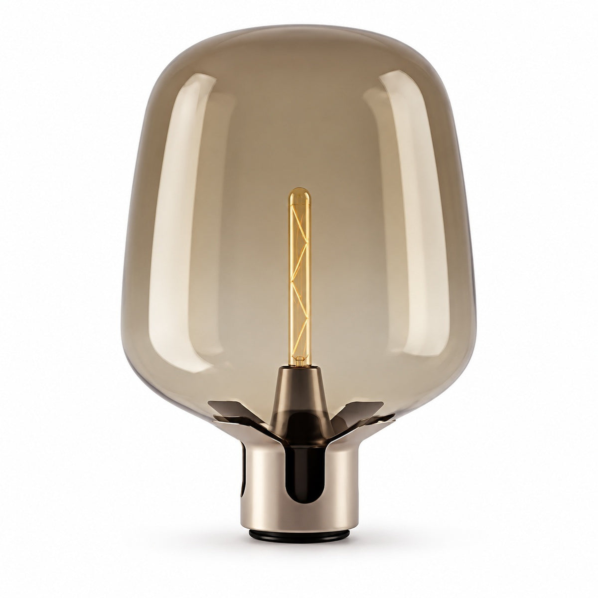 A modern table lamp with a large, rounded translucent smoke-tinted glass shade and a metallic brushed brass base, featuring a visible warm-toned filament bulb inside, set against a plain white background.