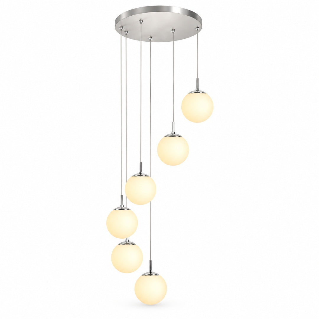 A modern multi-light linear pendant chandelier with a brushed nickel circular canopy, six slim hanging rods, and six warm white frosted glass globe shades of varying sizes, shown against a plain white background.
