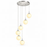 A modern multi-light linear pendant chandelier with a brushed nickel circular canopy, six slim hanging rods, and six warm white frosted glass globe shades of varying sizes, shown against a plain white background.