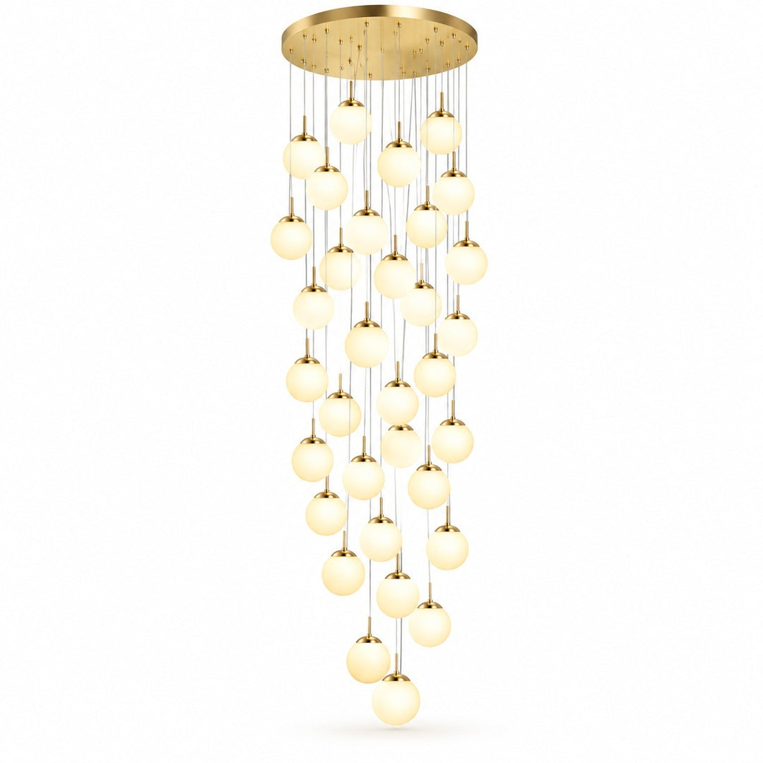 A modern multi-light chandelier with a circular gold ceiling canopy and multiple cascading strands of glowing warm white spherical glass bulbs, shown against a plain white background.