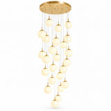 Gold chandelier with a round ceiling canopy and cascading illuminated glass globes suspended at varying heights against a white background.