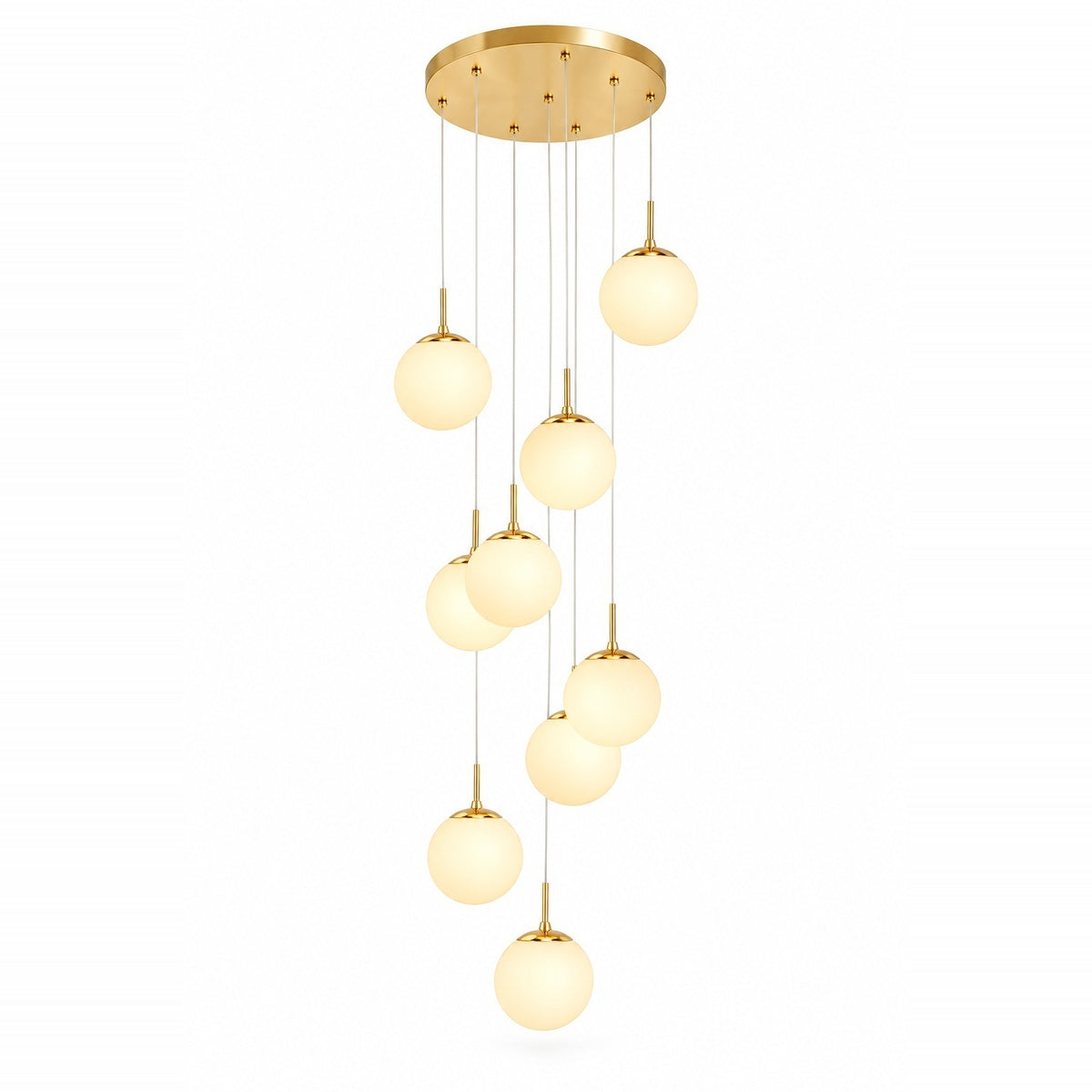 A modern multi-light pendant chandelier with a gold circular ceiling canopy and nine glowing frosted glass globe shades of varying sizes, suspended by thin cables against a plain white background.