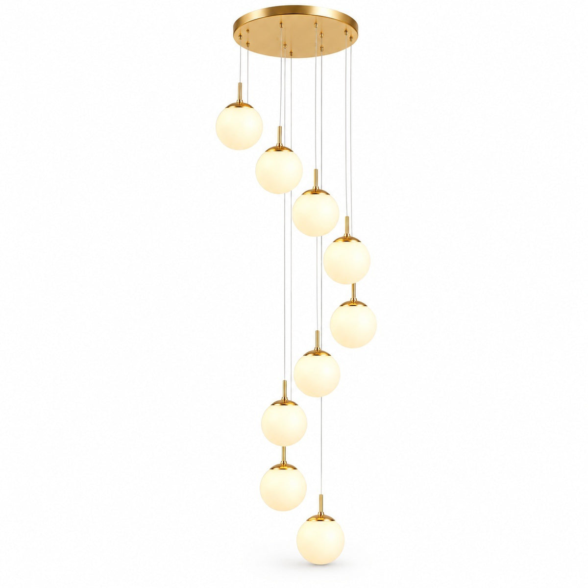 A modern multi-light linear pendant chandelier with a brushed gold circular ceiling canopy, multiple thin suspension wires, and nine glowing frosted glass globe shades arranged in a staggered vertical line.
