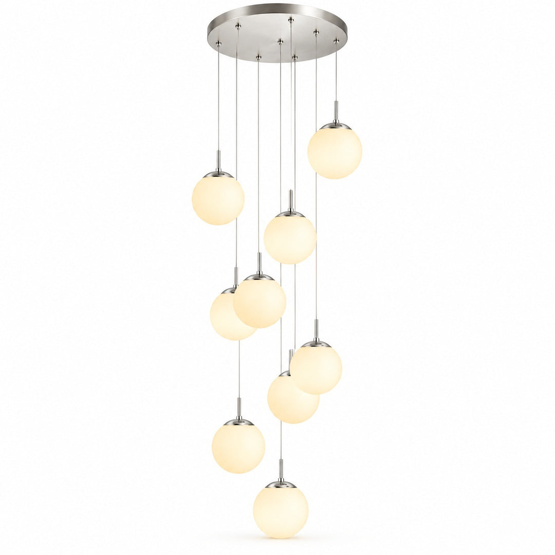 A modern multi-light linear chandelier with nine warm white frosted glass globe shades hanging from a brushed nickel circular canopy against a white background.
