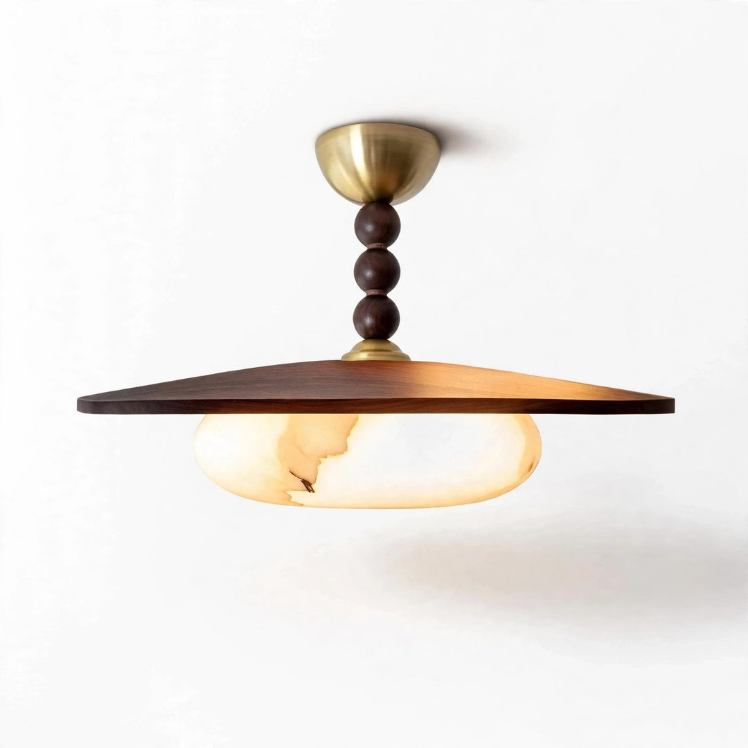 Pendant light with a wide brown wooden shade, glowing marble-effect glass, dark rounded stem details, and gold-toned canopy against a white background.