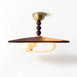 Pendant light with a wide brown wooden shade, glowing marble-effect glass, dark rounded stem details, and gold-toned canopy against a white background.