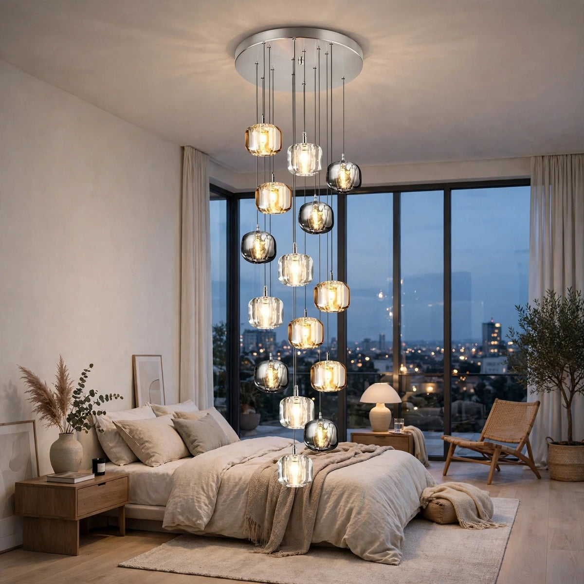 A modern multi-light chandelier with clear glass spherical bulbs hangs over a bed in a styled bedroom with large windows, city view, and neutral decor.
