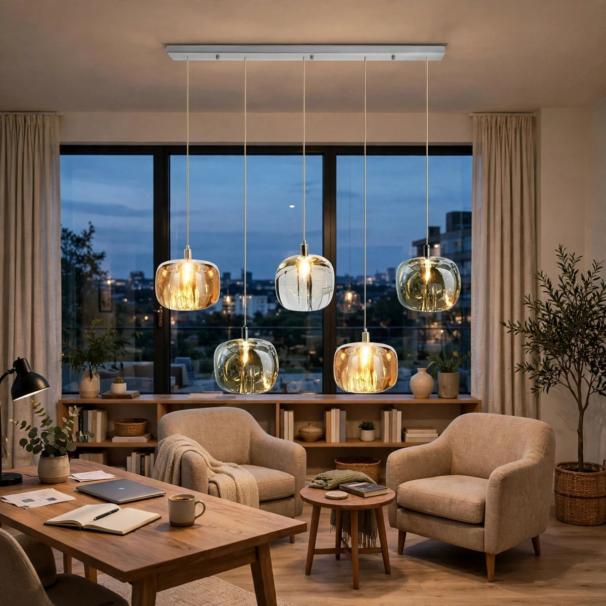 A five-light linear chandelier with amber, clear, and smoky crystal shades hangs in a sitting area beside a wooden desk.