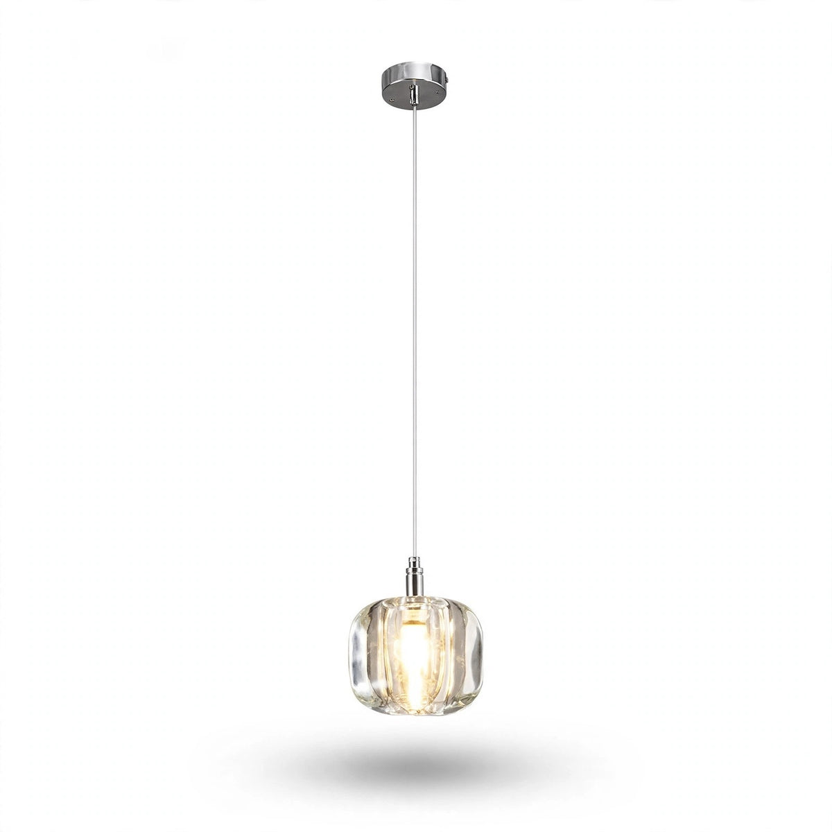 A single-light chandelier with a clear rounded crystal shade and polished silver canopy glows warmly against a white background.