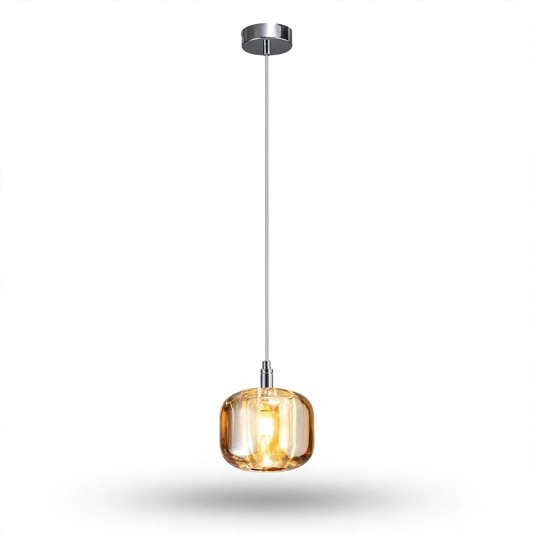 A single-light chandelier with an amber rounded crystal shade and polished silver canopy glows warmly against a white background.