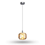 A single-light chandelier with an amber rounded crystal shade and polished silver canopy glows warmly against a white background.