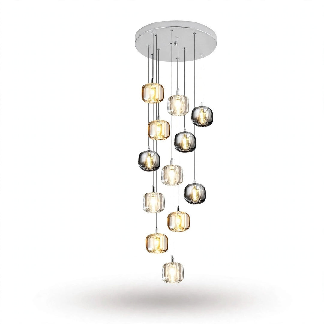 A twelve-light chandelier cascades from a round silver canopy, with clear, amber, and smoky grey crystal shades against a white background.