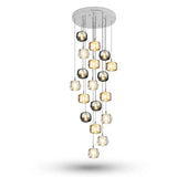 A chandelier cascades from a round silver canopy, with eighteen illuminated amber, clear, and smoky grey shades against a white background.