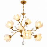 A 5-light gold chandelier with elegant flower-shaped frosted glass shades and clear crystal accents, shown against a solid white background.