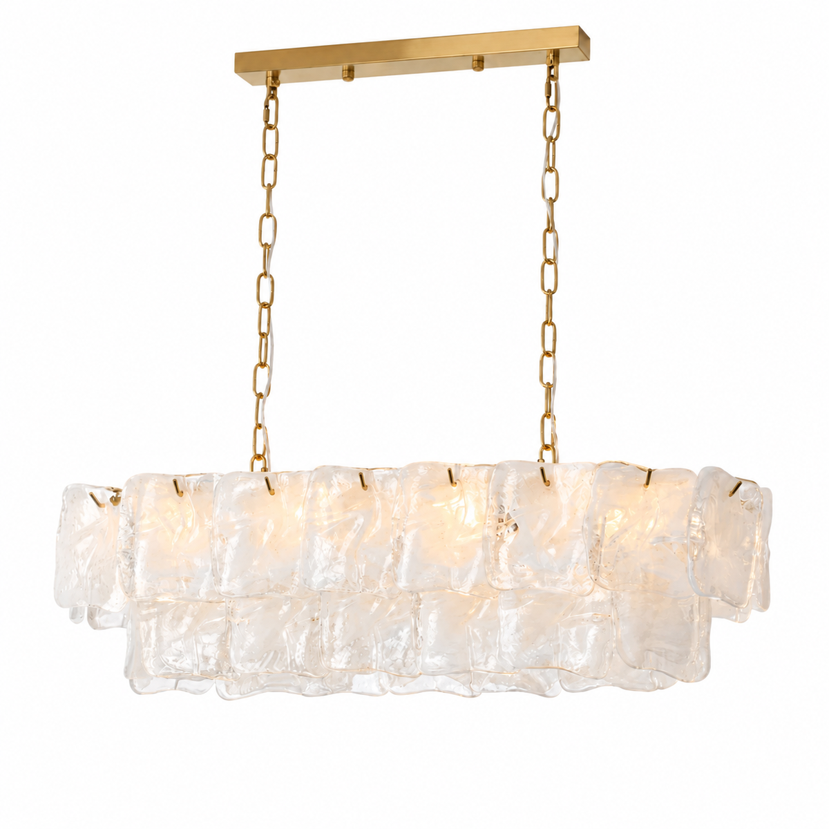 Linear chandelier of overlapping clear frosted art glass tiers hanging from gold chains beneath a gold rectangular ceiling canopy.