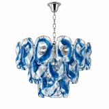 A modern chandelier with a silver-toned metal ceiling canopy and chain, featuring multiple organic-shaped glass shades in a swirling blue and clear glass design, shown against a plain white background.
