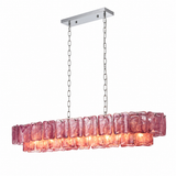 A linear chandelier with purple rippled glass panels hangs from silver chains and a matching rectangular canopy against a white background.